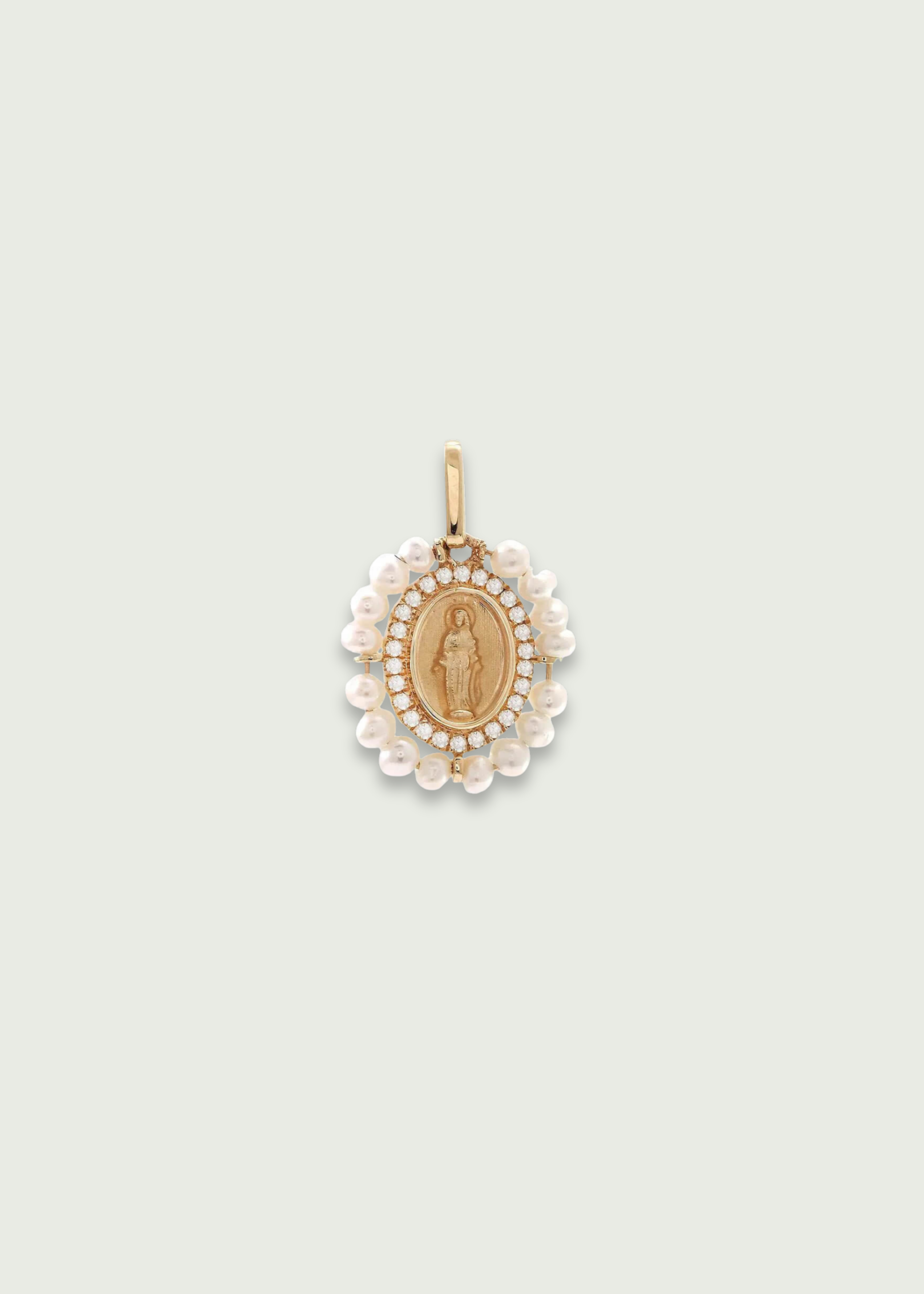 Pearl and diamond Virgin Mary pendant in 14K gold featuring detailed medallion and halo of pearls and diamonds. virgin mary diamond pendant.
