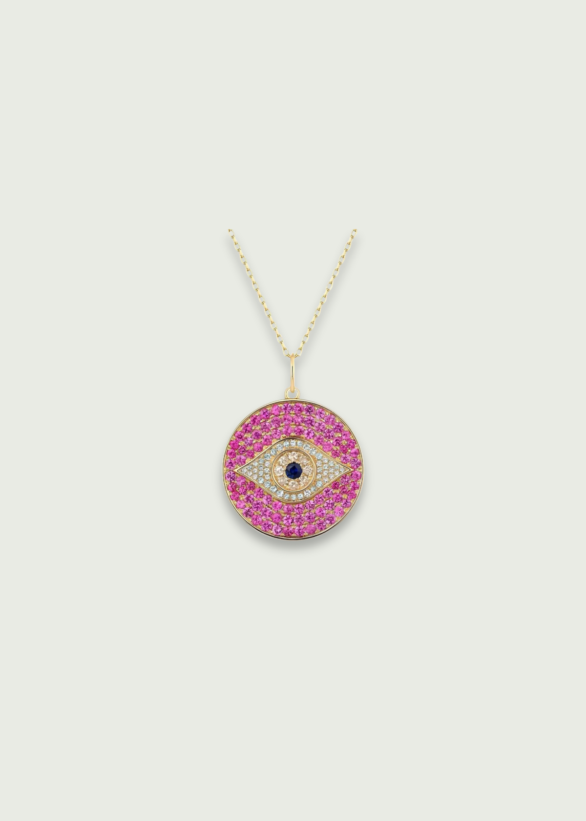 Pink Evil Eye Necklace featuring pink sapphires and a diamond inlay on a gold chain.